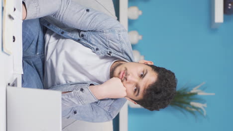 Vertical video of Pensive man.