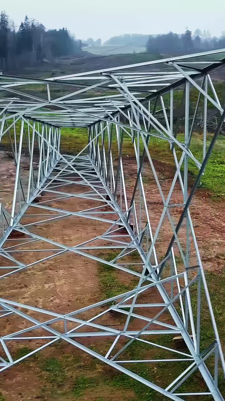 High voltage power line pole frame ready for construction, aerial vertical view