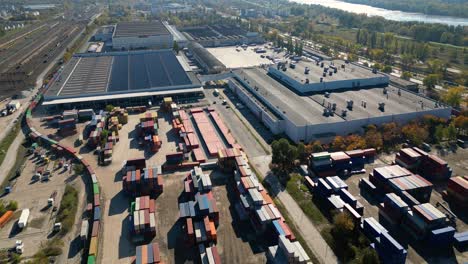 Aerial-view-of-shipping-containers,-semi-trucks-cargo-distribution-of-containers