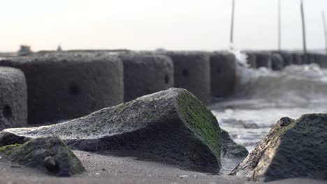 close up of rock breaking sea waves