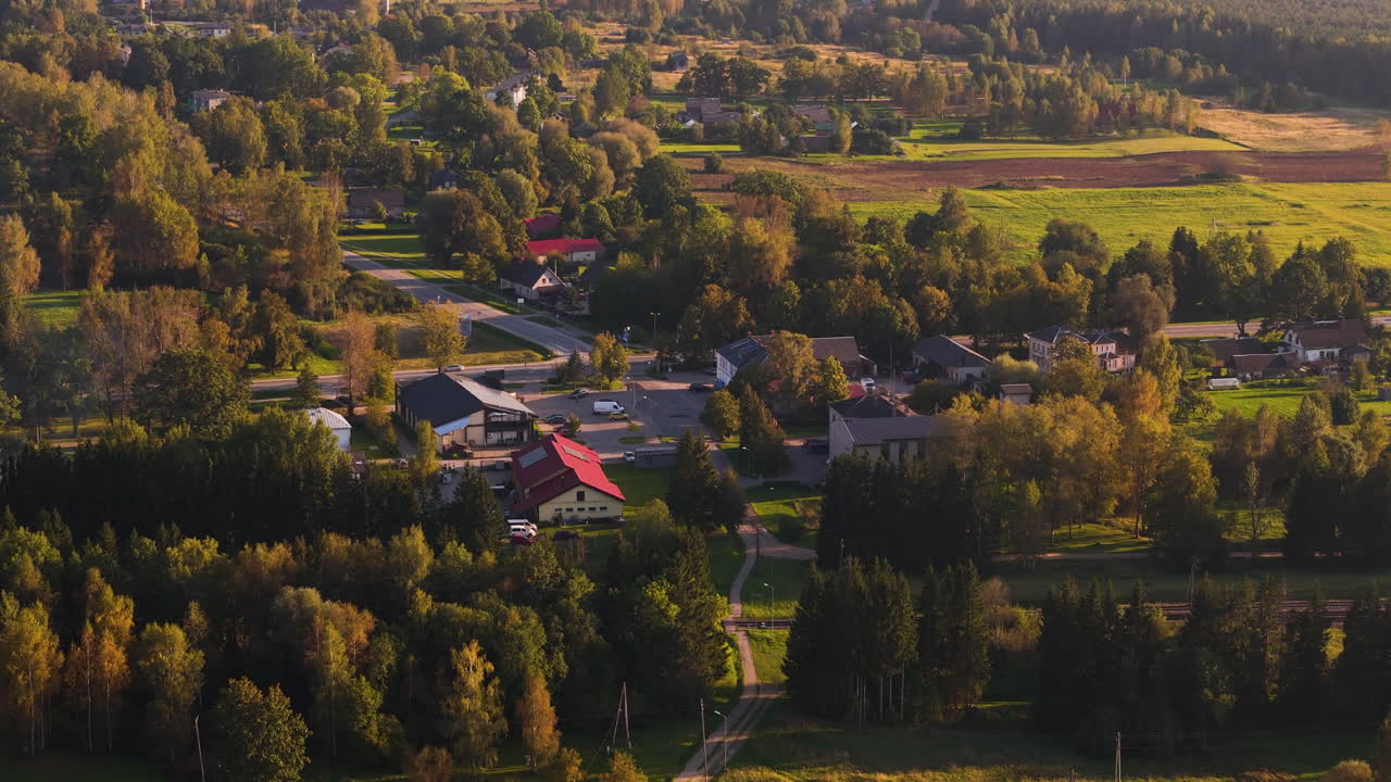 Aerial flying over buildings in Augsligatne town during summer, Latvia