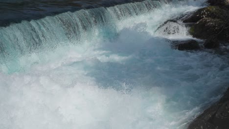 clean waterfall flowing in a mountain river at the norway