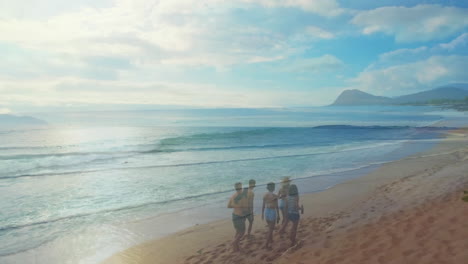 walking along sandy beach, group enjoying ocean waves with distant mountains