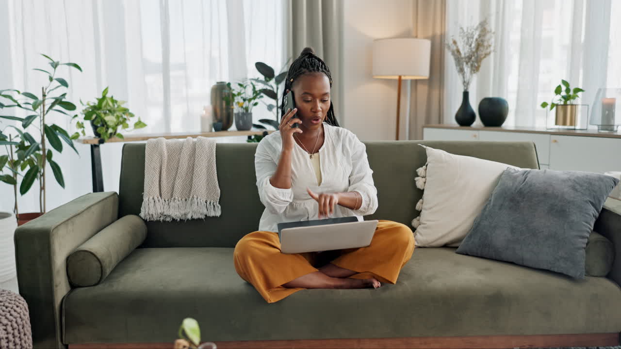 Black woman on sofa, phone call