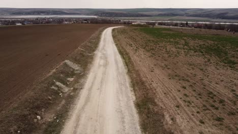 aerial view following dirt​ road