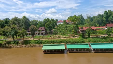 peaceful river view with lush greenery and houses