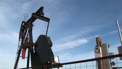 Mediumshot-Of-An-Oil-Pump-Turning-In-The-New-Mexico-Desert