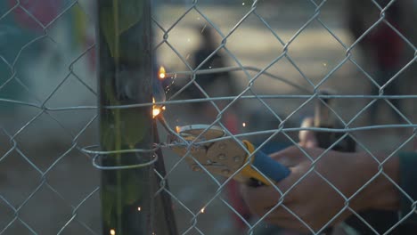 arc welding close up sparks fence construction