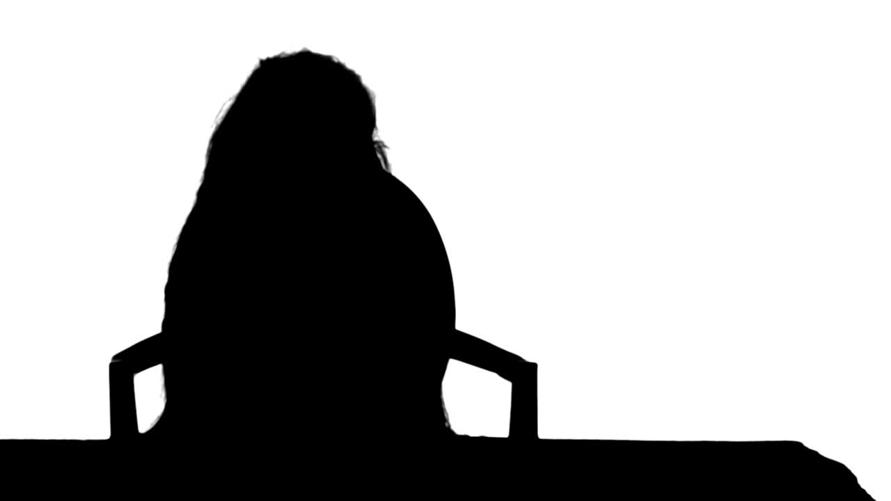 Silhouette Little girl writes to writing-book track matte