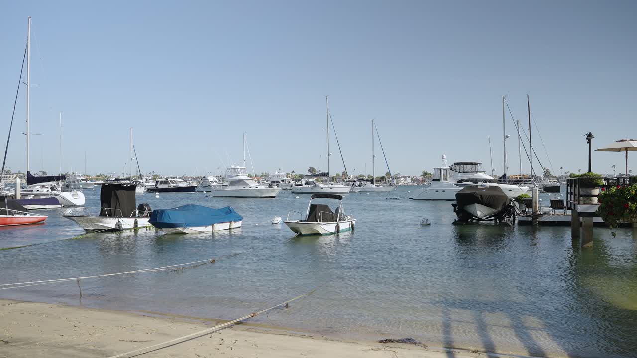 Multiple ships stationary by the beach