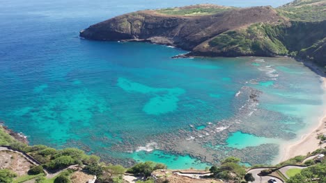 close-up aerial panning shot of hanauma bay nature preserve on the island of o'ahu, hawaii