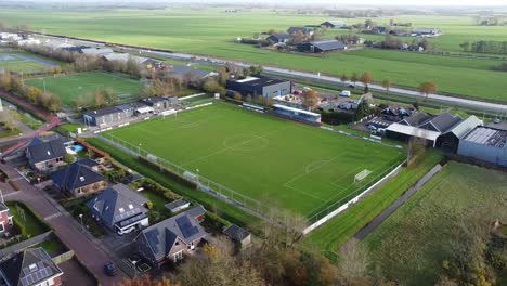 Soccer-field-and-football-field-from-above-in-The-Netherlands,-Ten-Boer