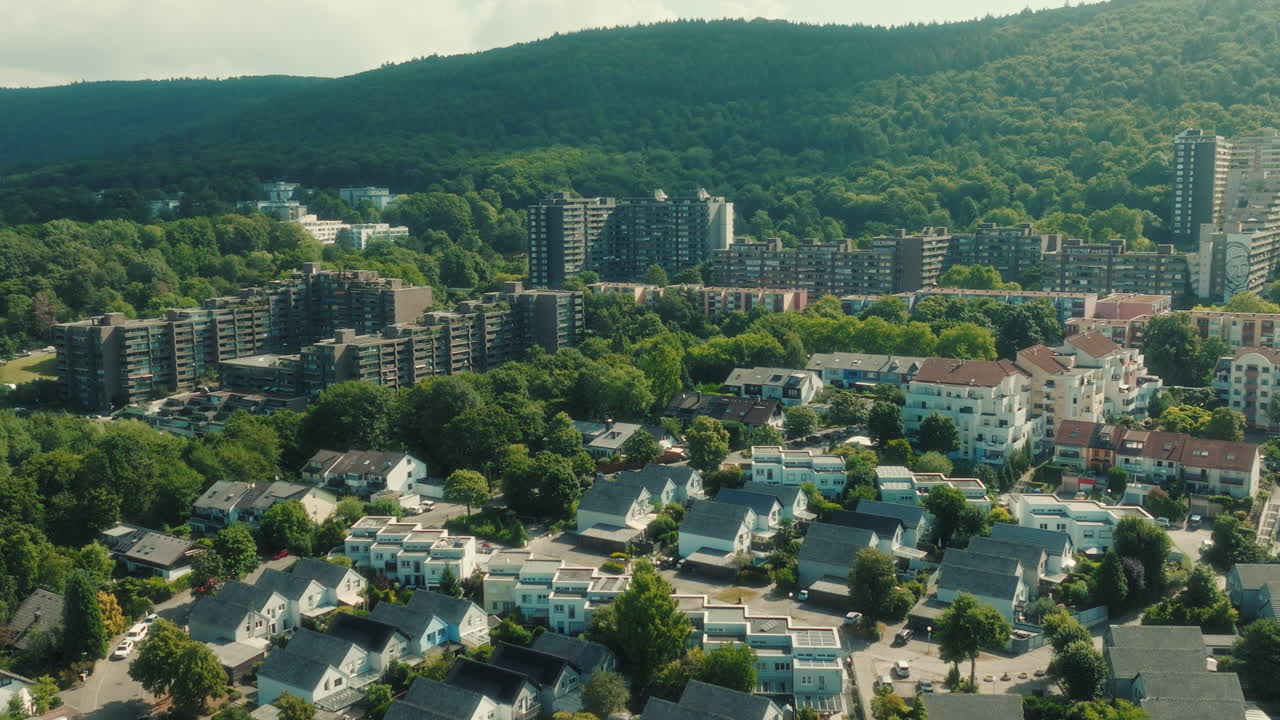 Aerial: Emmertsgrund neighborhood and cityscape during the day in Heidelberg, state of Baden-Wurttemberg, Germany, pull out drone shot
