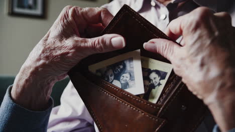 elderly woman looking through old photos