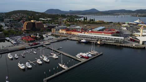 Constitution-Dock,-Hobart-waterfront-precinct-Meeting-point-for-the-finalists-of-the-Sydney-to-Hobart-Yacht-race,-Derwent-river-,-drone-footage