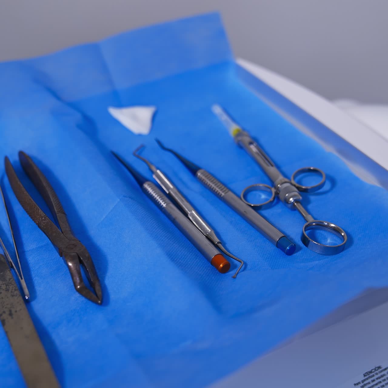 Metal tools for dentistry laid on napkin. Some rather old instruments for removal of teeth that can't be treated. Close up