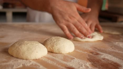 baker making bread dough