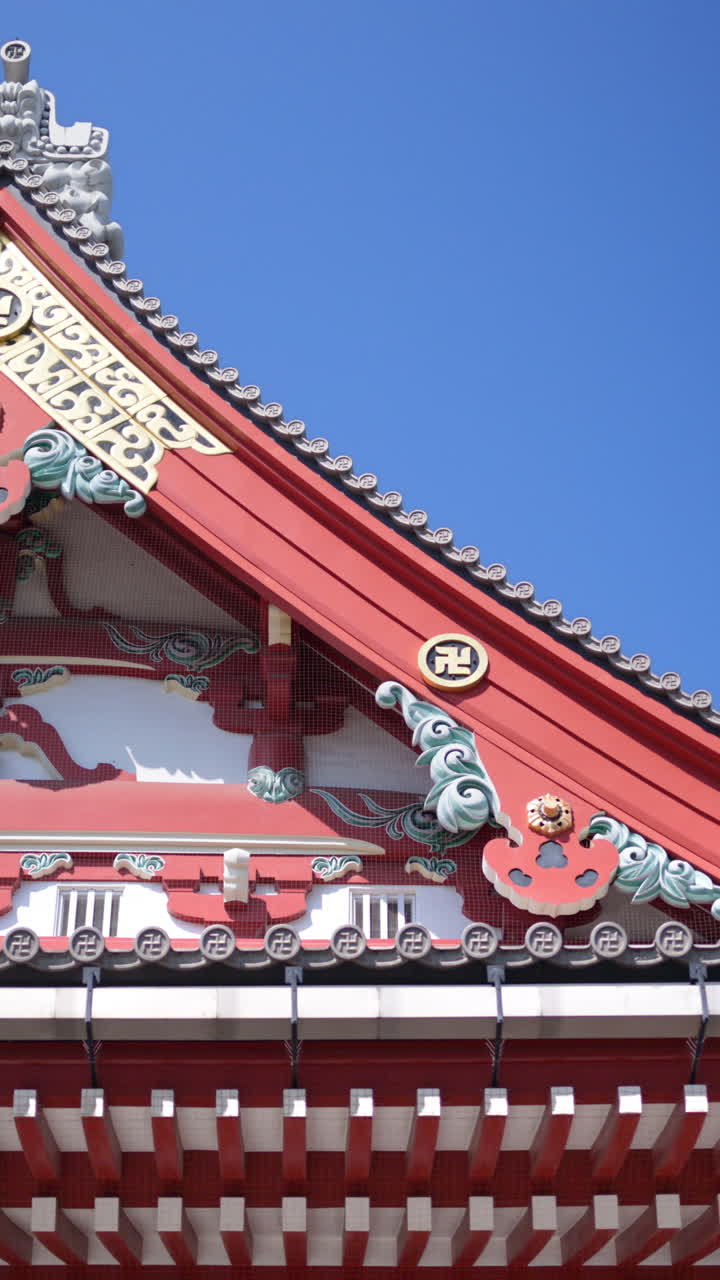 View of the Senso-ji temple with the blue sky on the background in Asakusa, Japan. Vertical