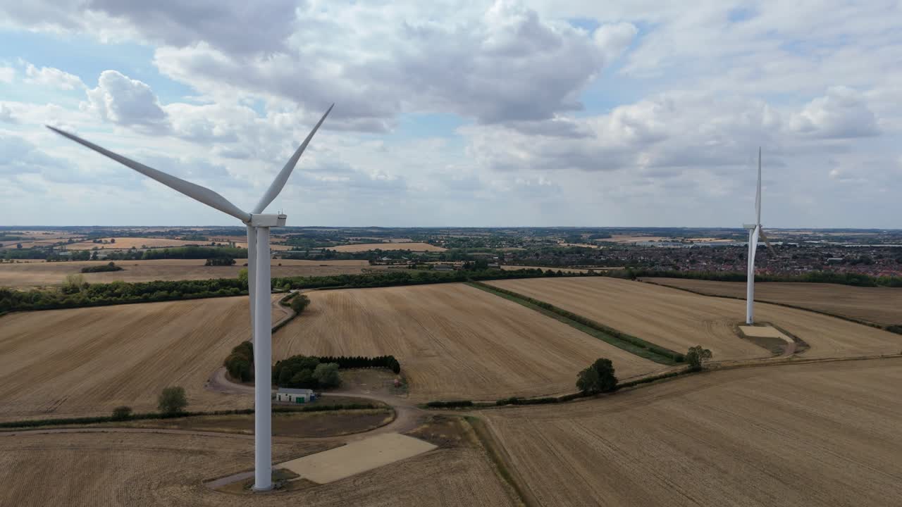 Overhead perspective of wind energy turbines in farmland near Burton Latimer England highlighting sustainable energy generation