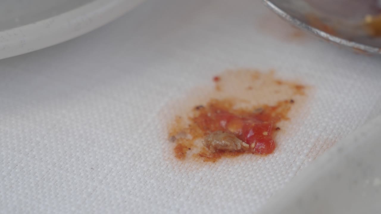 Spilled Tomato Sauce on Tablecloth