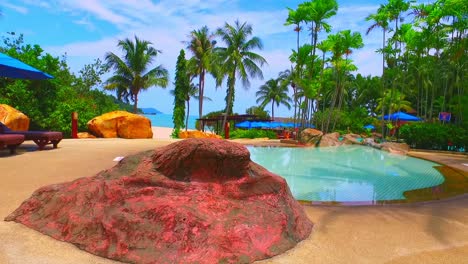 very beautiful swimming pool of a luxury resort with coconut palm trees langkawi malaysia