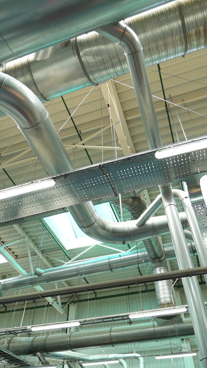 Ventilation ducts. Modern industrial factory Vertical video