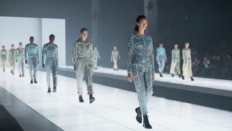 a futuristic fashion show featuring models wearing innovative outfits with illuminated designs on a high-tech runway environment in a captivating atmosphere