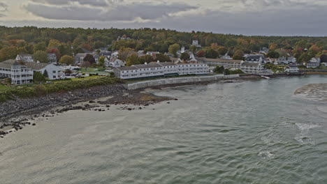 ogunquit maine aerial v5 low level flyover rocky shores capturing beautiful townscape with beach views and sun shinning on river water surface - shot with inspire 2, x7 camera - october 2021