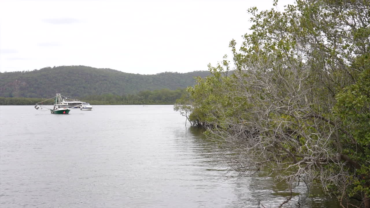 A fishing vessel moored up on the Hawkesbury river near Spencer, NSW Australia