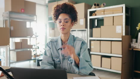 woman working in office with boxes