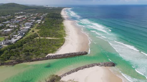 drone flyover of beach and ocean waves