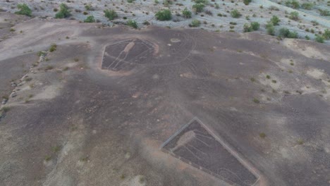 aerial drone shot of blythe intaglios, two unique ancient geoglyphs drawn in sonoran desert terrain