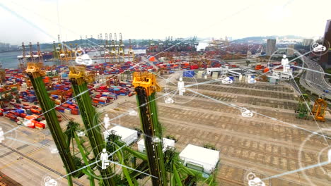 red de iconos digitales contra vista aérea del almacén del puerto marítimo