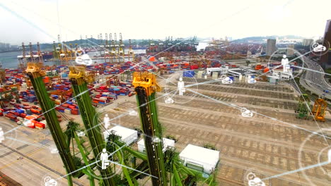 network of digital icons against aerial view of sea port warehouse