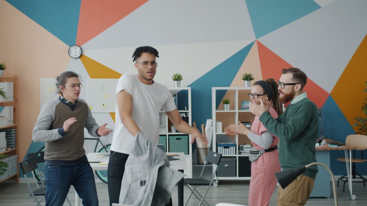 Team Celebrating in Office