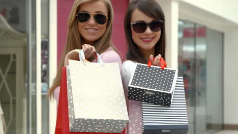 happy friends in the shopping mall