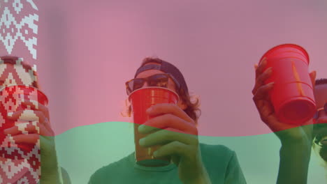 Holding red cup, person wearing sunglasses and cap with animation overlay effects