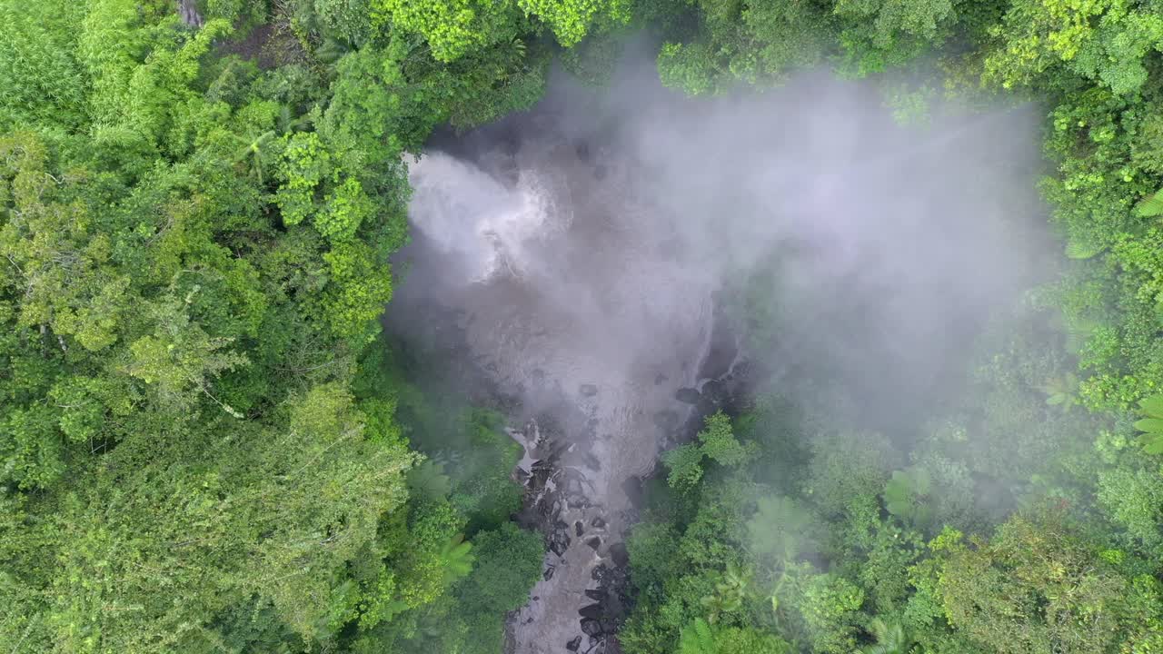 4K Nungnung waterfall nestled in Bali's Jungle in Indonesia