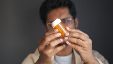 person holding a pill bottle