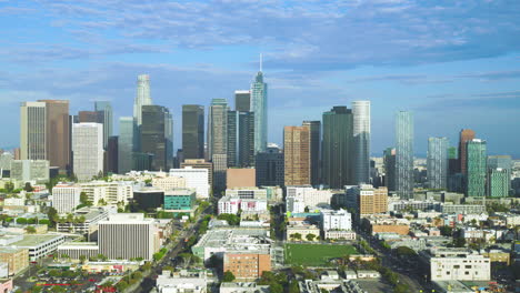 slow orbiting shot of the vast skyscrapers in downtown los angeles during summer