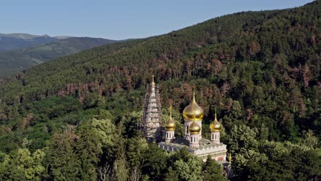 beautiful golden domes of shipka memorial church balkans bulgaria on blue sky morning aerial shot