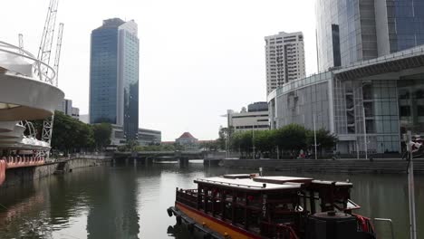 tourist boat cruising along a city river.