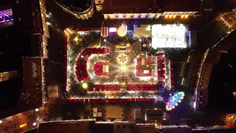 top down view sibiu christmas fair, romania at night time with festive lights