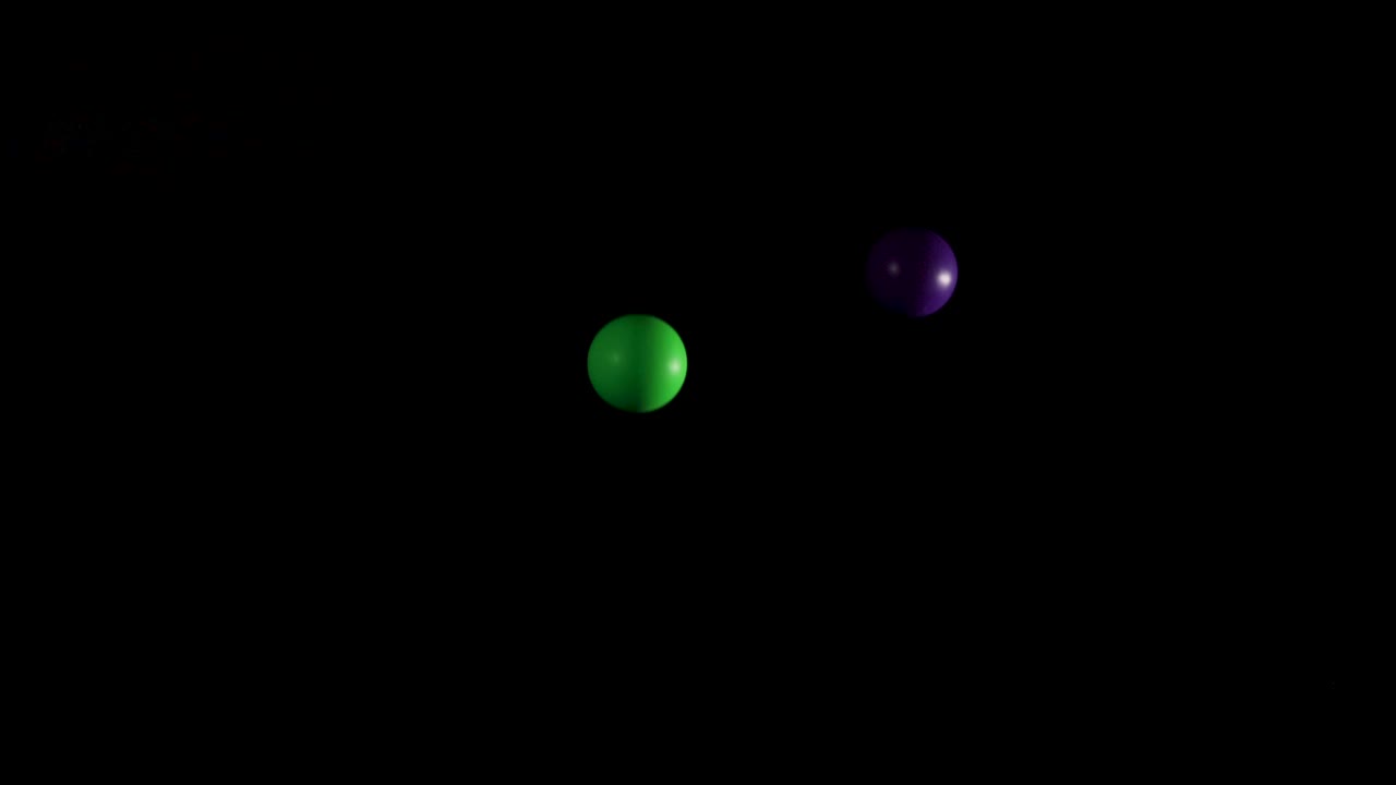 bolas de colores rebotando en el fondo oscuro