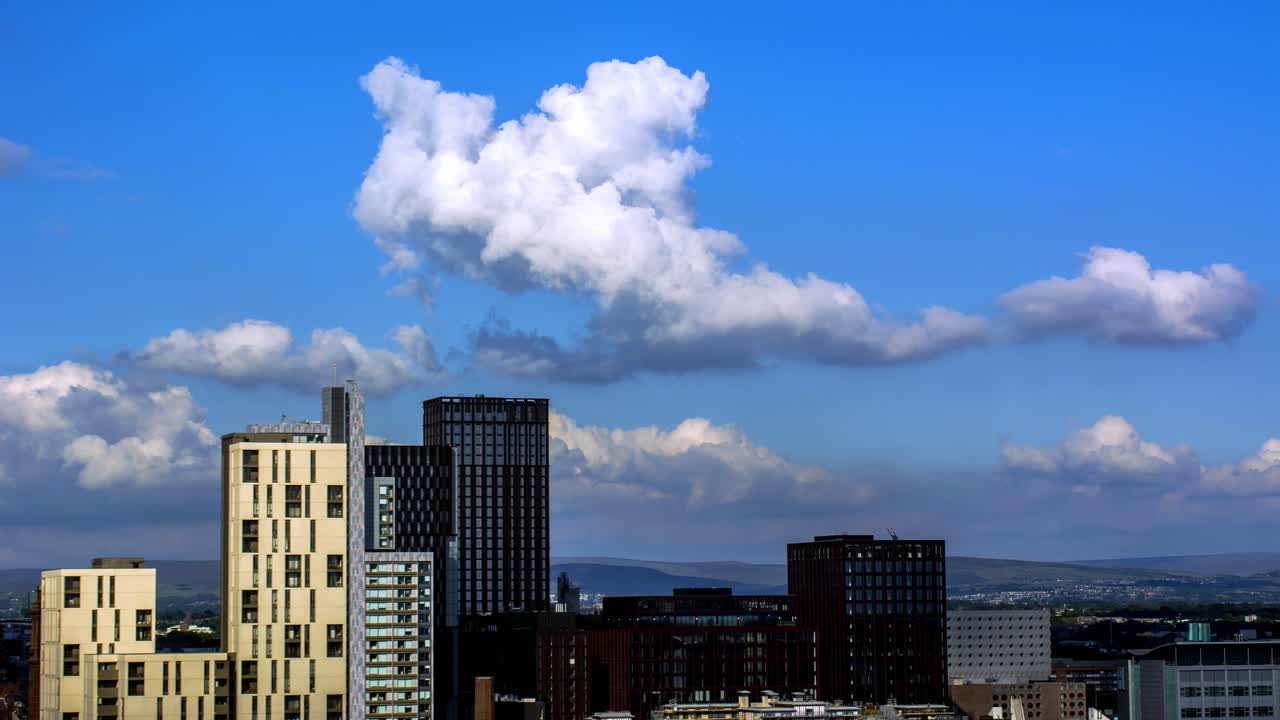 MANCHESTER, UK - 2021: Landscape artistic view of the Manchester UK Rolling Clouds on a sunny day Time Lapse