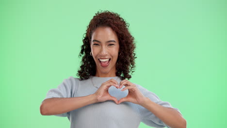happy woman making a heart shape with her hands
