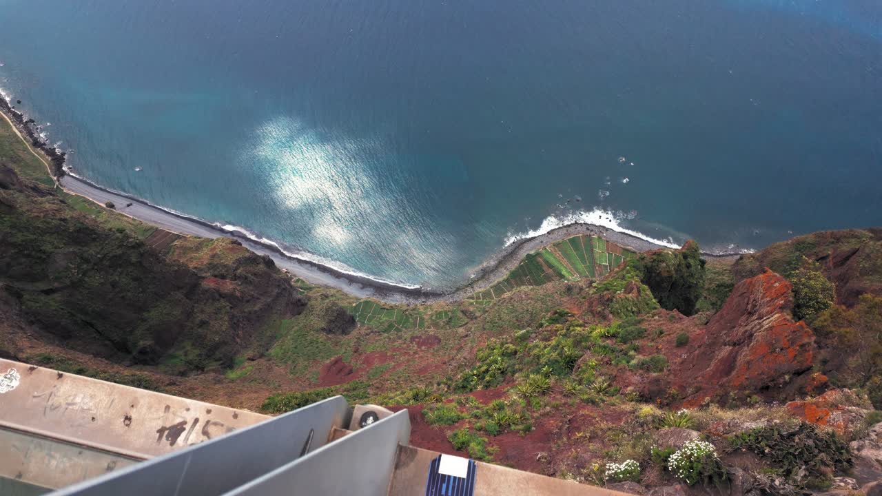 Looking down the steep sea cliff on Cabo Girao on Madeira island, Portugal