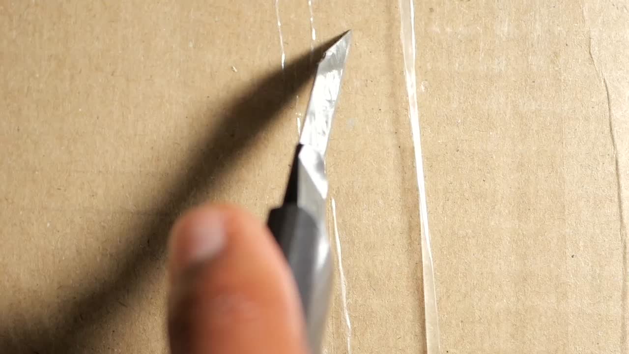 Hand Cutting Cardboard Box with Utility Knife