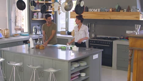 children helping parents with domestic chores in kitchen