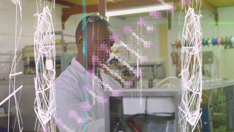 animación de una cadena de adn sobre un científico afroamericano que trabaja en un laboratorio
